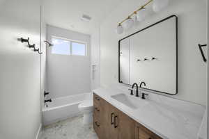 Full bathroom with vanity and bathtub / shower combination