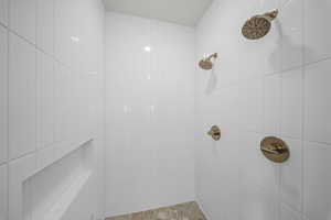 Full bathroom with tiled shower
