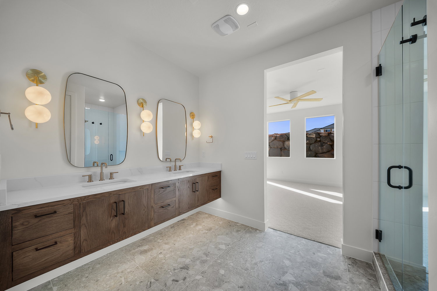 Bathroom featuring double vanity, a shower stall, and a bath