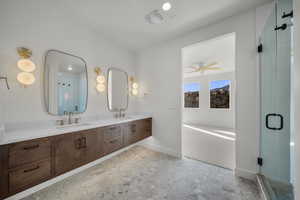 Bathroom featuring double vanity, a shower stall, and a bath