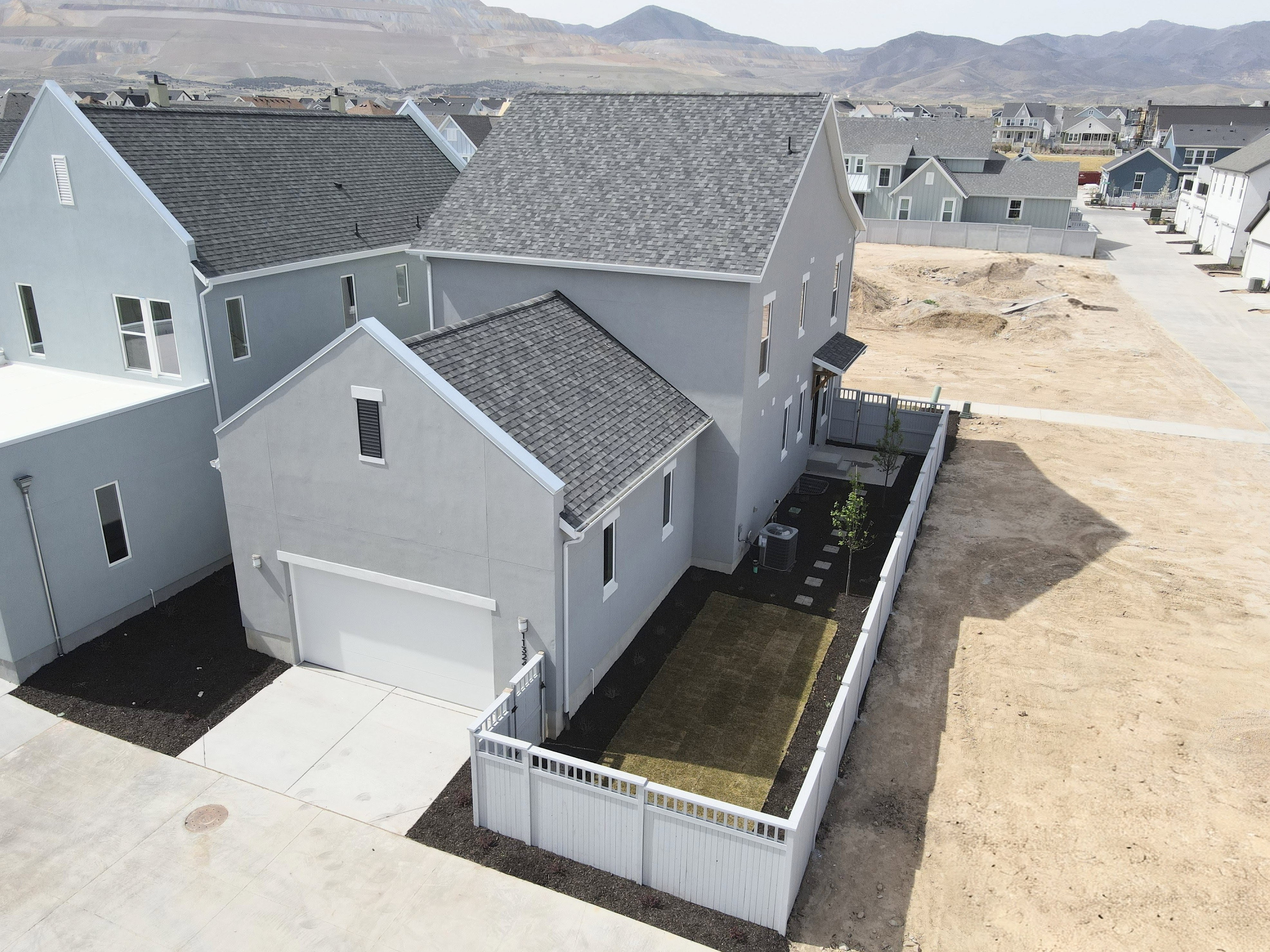 Aerial view of fenced yard with mountains