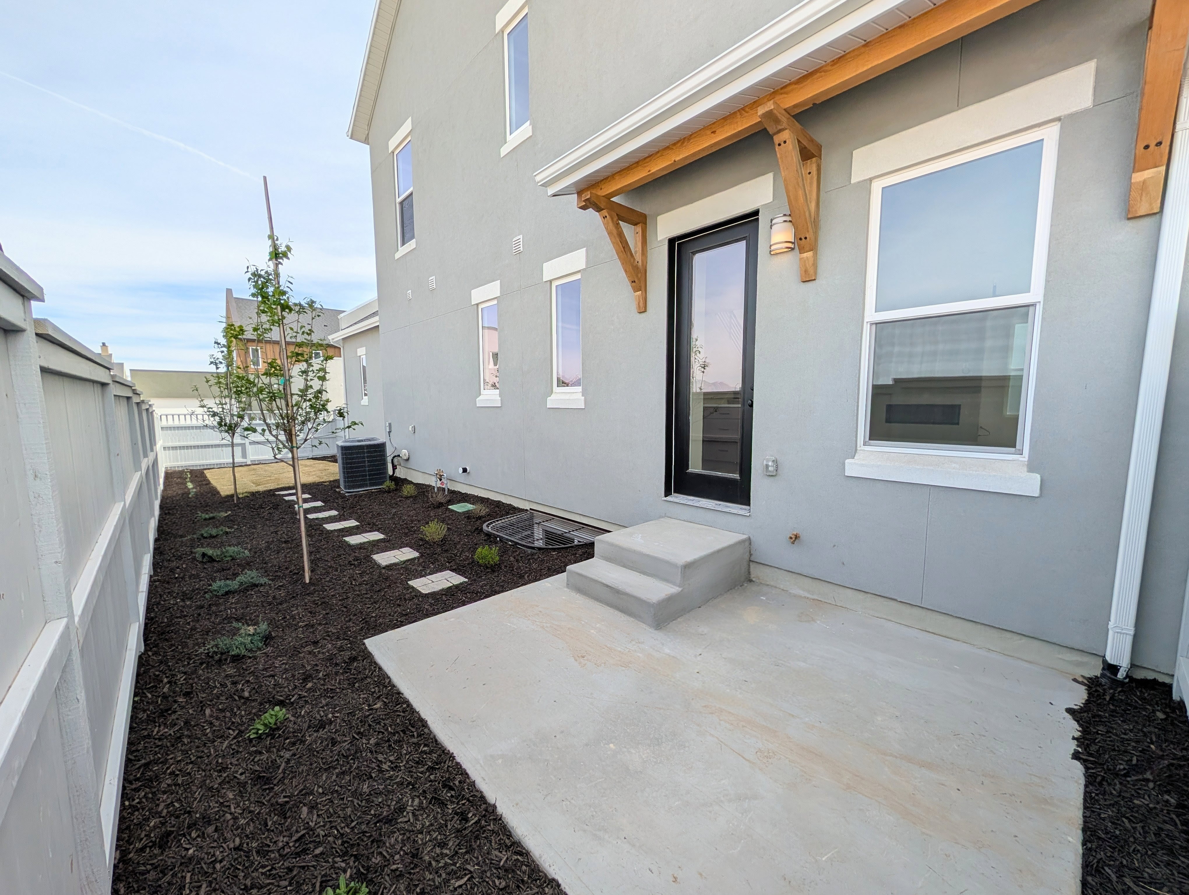Fenced backyard featuring a patio