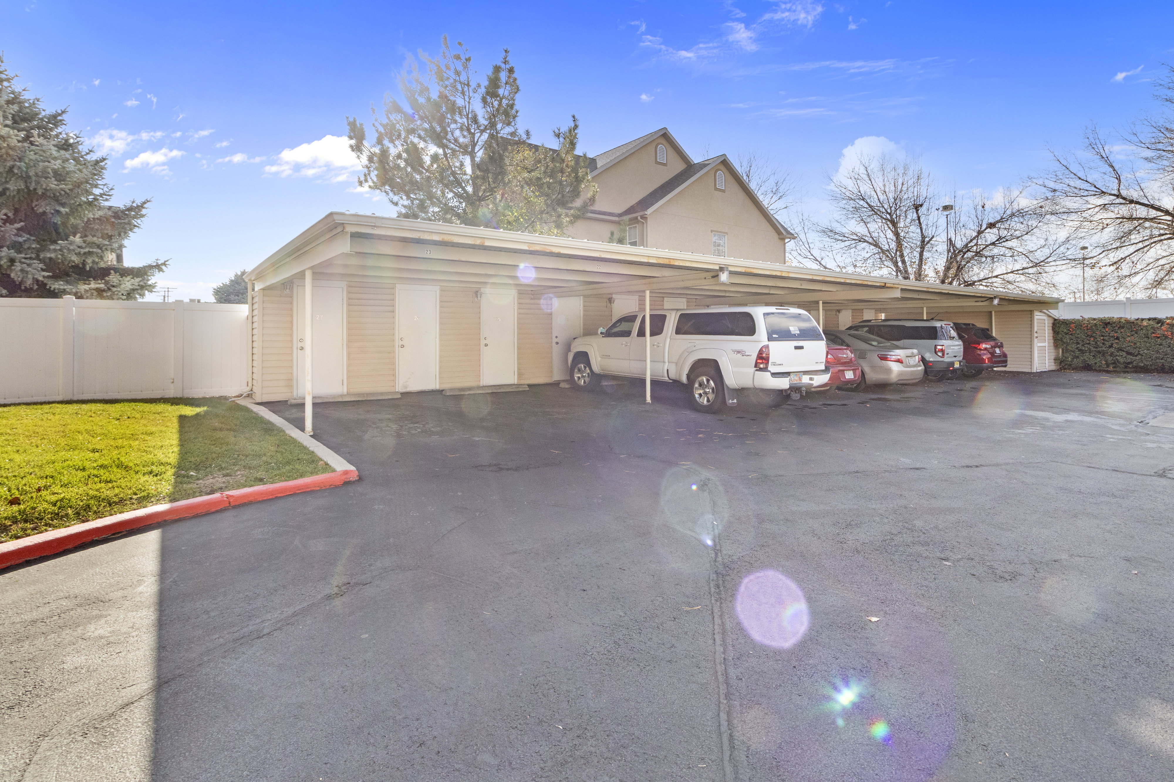 Garage featuring covered parking