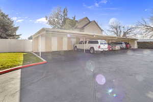 Garage featuring covered parking