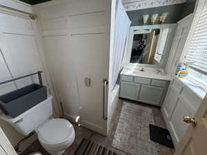 Bathroom with vanity and shower / tub combo