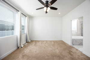 Unfurnished bedroom with a ceiling fan, light carpet, and recessed lighting