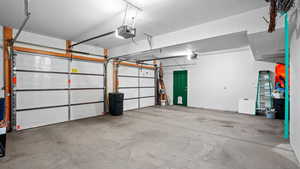 Garage featuring a garage door opener