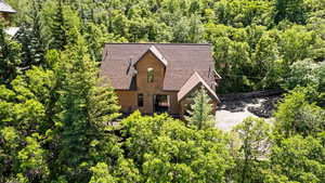 View from above of property with a heavily wooded area