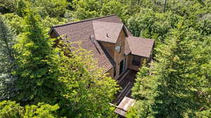 View of subject property featuring a heavily wooded area