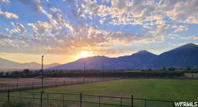 View of mountain background featuring rural landscape and agricultural land