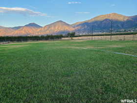 View of mountain background with rural landscape and agricultural land