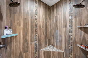 Full bathroom with tiled shower