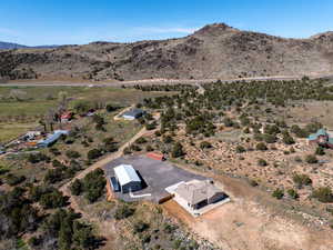 Aerial view of sparsely populated area featuring a desert landscape and mountains