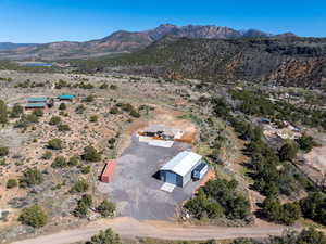 Aerial view of sparsely populated area with mountains and a desert landscape