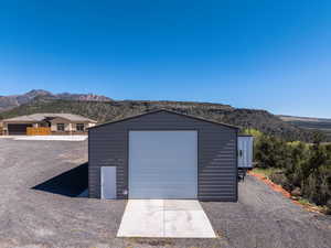 Detached garage featuring a mountain view