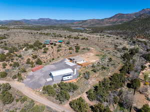 View of rural area featuring a desert landscape and a mountain backdrop