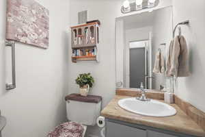 Half bath with toilet and vanity