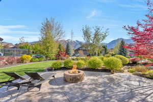 View of patio featuring an outdoor fire pit