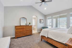 Master Bedroom with vaulted ceiling, carpet, ensuite bath, a ceiling fan, and recessed lighting
