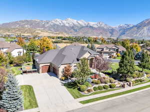 Aerial perspective of suburban area featuring a mountain backdrop