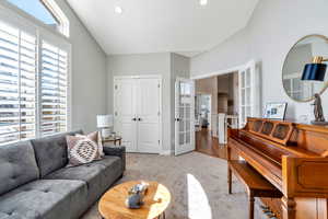 Bedroom being used as a den, with  carpet, French doors, and recessed lighting