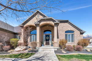 Outside Front Entrance to property with brick siding
