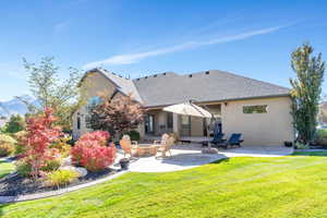 Fall Rear view of property with a patio area, an outdoor fire pit