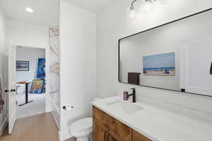 Bathroom  jack and jill with vanity and recessed lighting