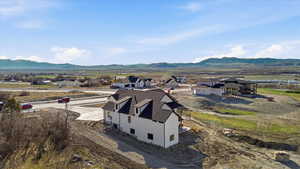Aerial view of residential area with a mountainous background