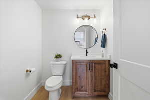 Bathroom featuring vanity and light wood finished floors