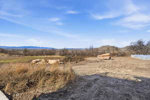 View of mountain background featuring rural landscape