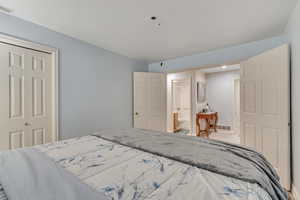 Bedroom with a closet and connected bathroom