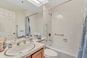 Full bath with vanity and shower / bath combo