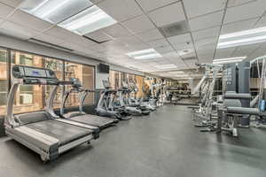 Exercise room featuring a drop ceiling