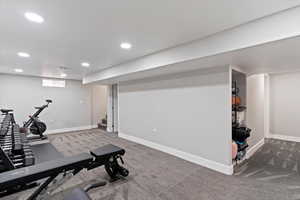 Workout room featuring light colored carpet and recessed lighting