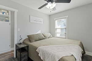 Bedroom featuring a ceiling fan and baseboards