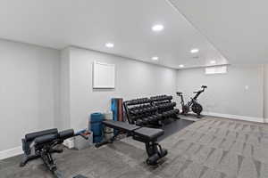 Exercise room featuring recessed lighting and carpet floors