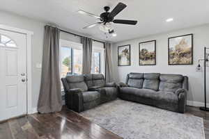 Living area featuring wood-type flooring, ceiling fan, and recessed lighting