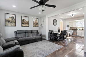 Living area with dark wood-style floors, recessed lighting, and ceiling fan