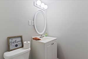 Bathroom featuring vanity and toilet