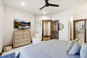 Bedroom featuring light carpet, a ceiling fan, connected bathroom, and recessed lighting