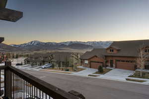 View of mountain backdrop featuring nearby suburban area