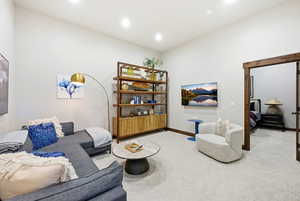 Living room featuring light carpet and recessed lighting