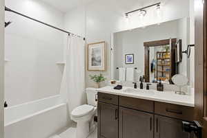 Full bathroom with vanity and shower / tub combo