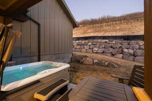 Exterior space with a hot tub
