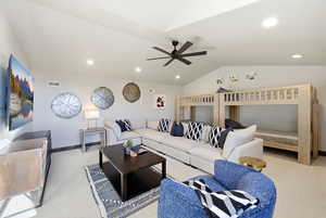 Living area with light carpet, ceiling fan, lofted ceiling, and recessed lighting