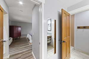 Hallway featuring light wood-type flooring