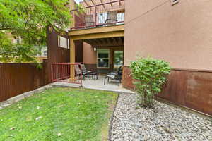 View of yard featuring a patio area and a balcony