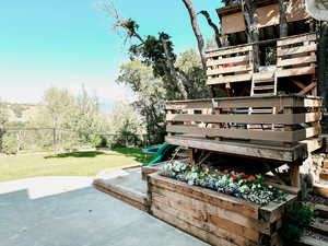 Fenced backyard featuring a patio