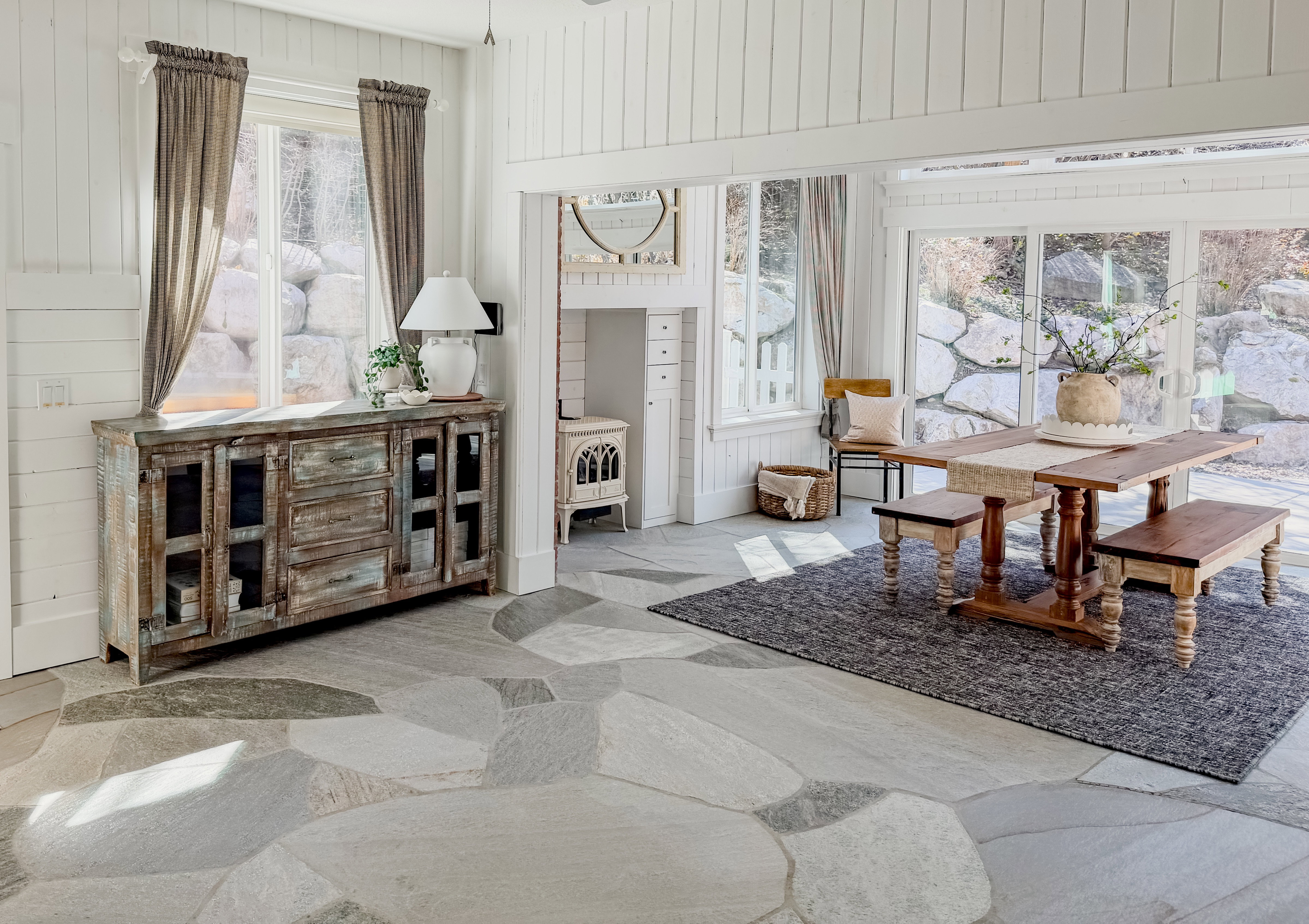 Sitting room with wooden walls and stone flooring